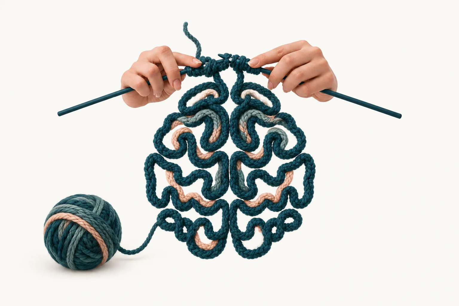 Teal and peach yarn forming a brain beneath knitting needles